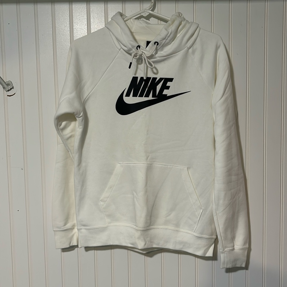 Woman’s white Nike hoodie